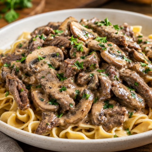 Healthy Beef Stroganoff with mushrooms and egg noodles